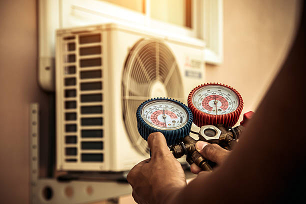 Professional Air Conditioning Service technician working in Castalia, OH